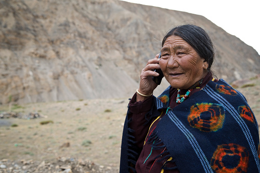 Portrait of elderly woman talking on mobile phone