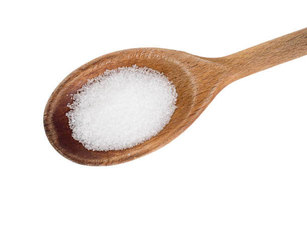 istock Fructose detail, on spoon isolated on white. 826001336