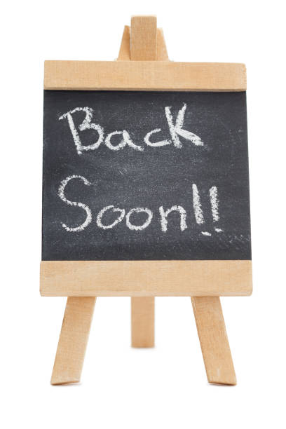 istock Chalkboard with the words back soon written on it 826011566