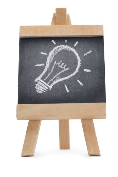 istock Chalkboard with a drawing of a lightbulb on it 826012250