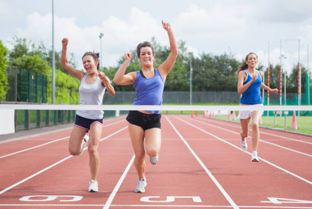 istock Athletes celebrating as they cross finish line 826014860