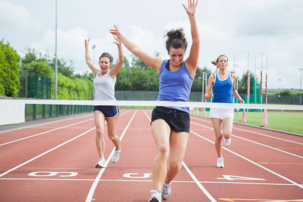 istock Athlete celebrates race win at finish line 826014872