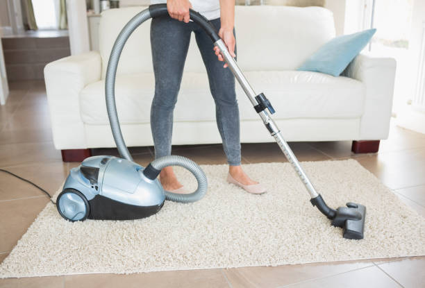 istock Woman hoovering rug 826015034