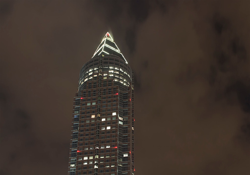 Night view of modern skyscraper in Frankfurt.