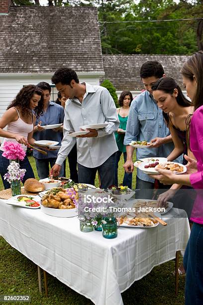 Hispanics At Outdoor Garden Party At Country Home Stock Photo - Download Image Now - Latin American and Hispanic Ethnicity, Medium Group Of People, 20-24 Years