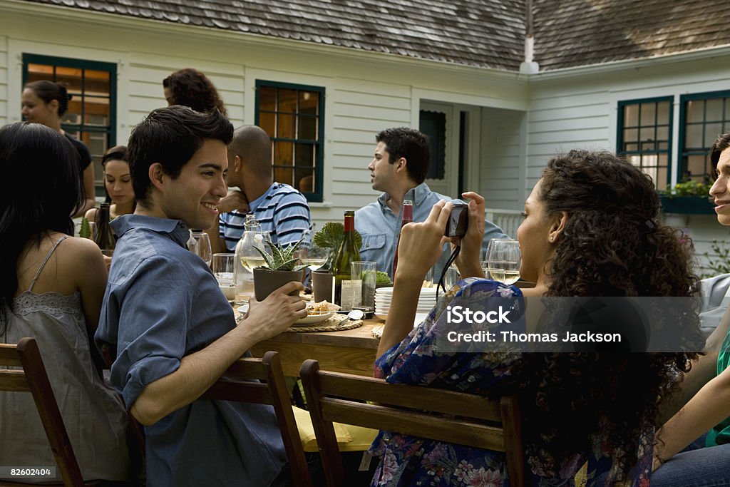  Hispanics at outdoor garden party at country home  Dining Stock Photo