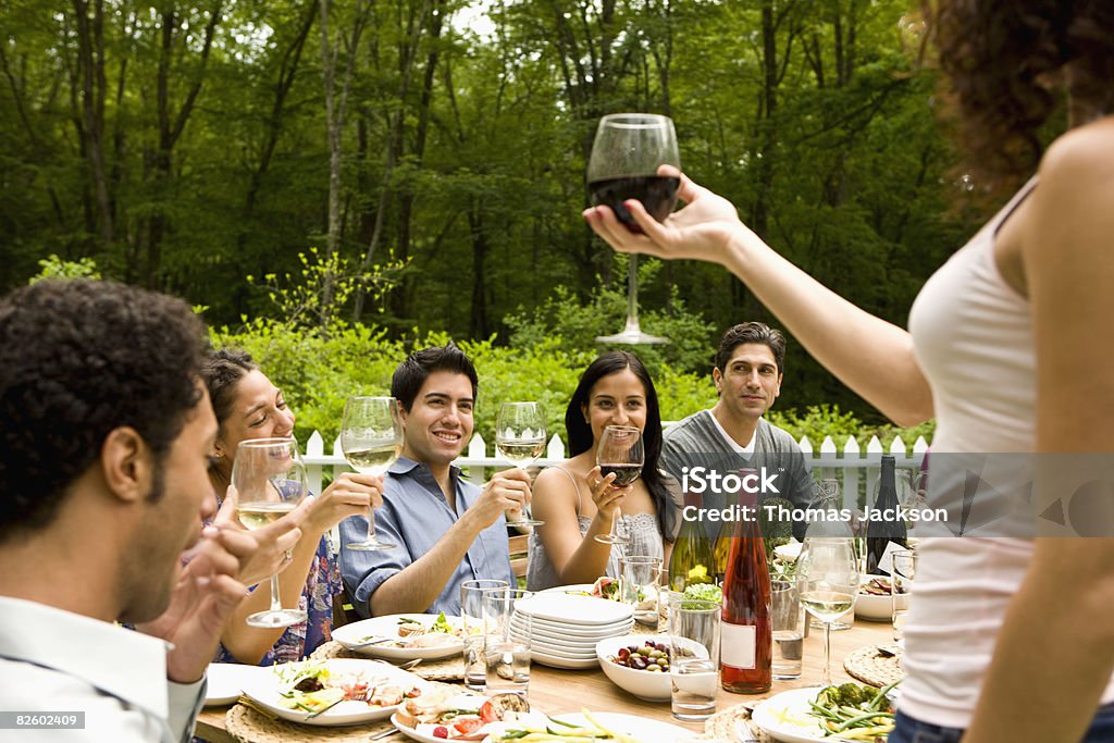  Hispanics at outdoor garden party at country home  20-24 Years Stock Photo