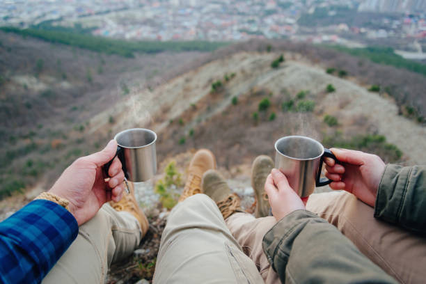 istock Couple drinking tea in the mountains. 826029490