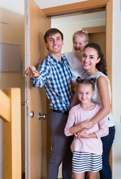 istock family standing at doorway 826036220