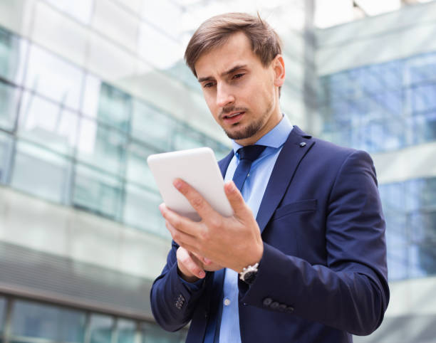 istock Male testing digital tablet and touchscreen in the big city 826036716