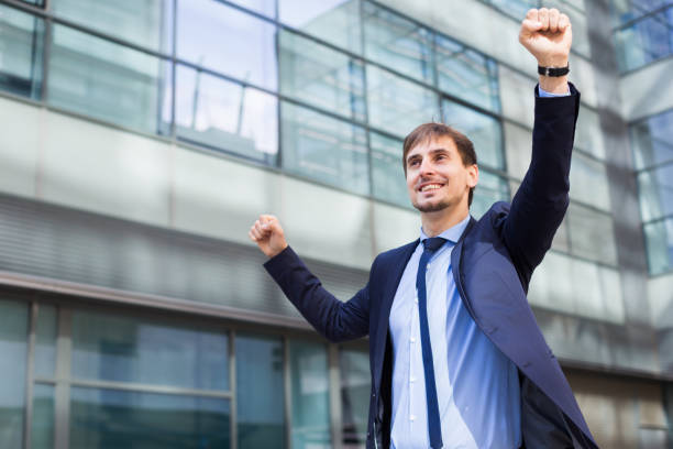 istock Portrait of smiling man in suit joying 826036820
