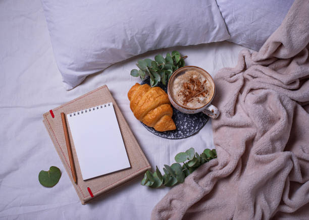 istock Breakfast in bad with croissants and  coffee 826036862