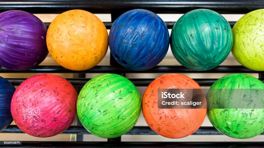 Colorful bowling balls Colorful bowling balls in return machine Bowling Ball Stock Photo