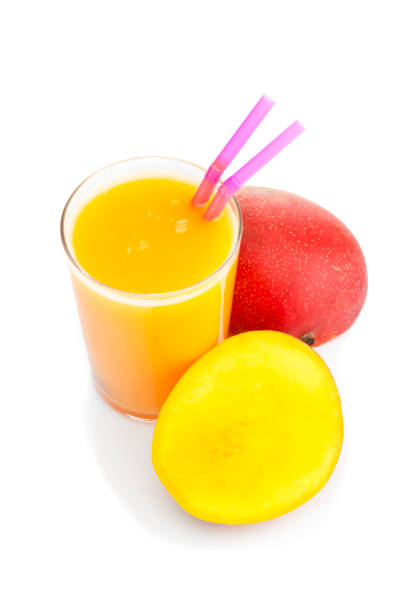 istock Mango juice glass isolated on white background 826043730
