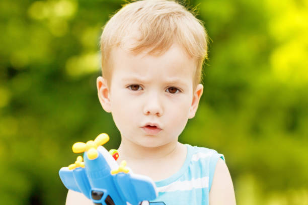 istock child boy playing with toy airplane 826044106