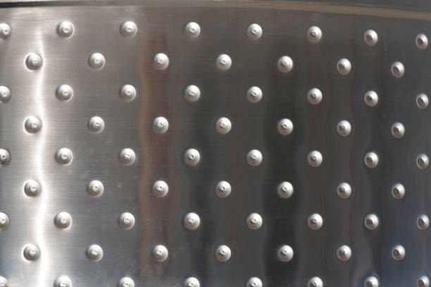 Metal plates with rivets background or texture photo