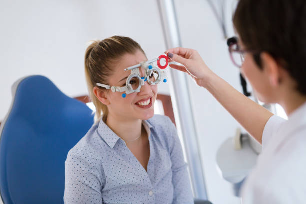 istock Woman doing eye test with optometrist in eye sight clinic 826047836