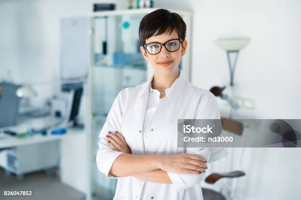 Portrait Of Female Optometrist At Eyesight Medical Clinic Stock Photo - Download Image Now