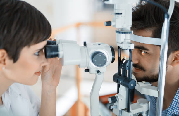 istock Woman doing eye test with optometrist in eye sight clinic 826047856