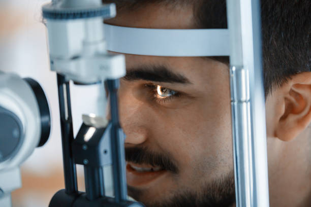 istock Patient or customer at slit lamp at optometrist or optician 826047862