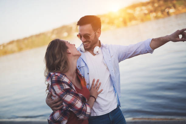 istock Beautiful couple hugging and dating on beach 826055270