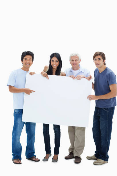 istock Smiling people holding and showing a big sign 826055718