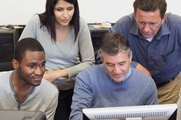 istock People looking at computer monitor 826058394