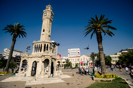 Historical Izmir Clock Tower (Turkish: İzmir Saat Kulesi) is a historic clock tower located at the Konak Square in the Konak district of İzmir, Turkey. People from Izmir and tourists from abroad visits the pace very often to take photographs. Also the location is very close to historical bazaar named Kemeralti.
