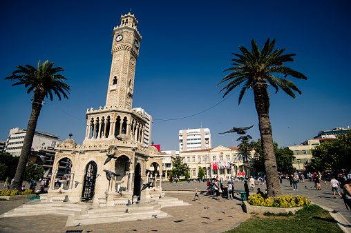 Historical Izmir Clock Tower (Turkish: İzmir Saat Kulesi) is a historic clock tower located at the Konak Square in the Konak district of İzmir, Turkey. People from Izmir and tourists from abroad visits the pace very often to take photographs. Also the location is very close to historical bazaar named Kemeralti.