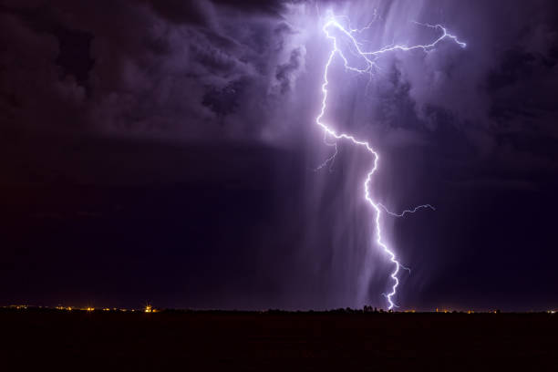 Lightning and thunderstorm Lightning bolt during a night thunderstorm. storm cloud sky dramatic sky cloud stock pictures, royalty-free photos & images