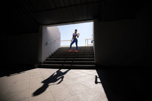 istock Woman athlete on stadium entrance 826093786