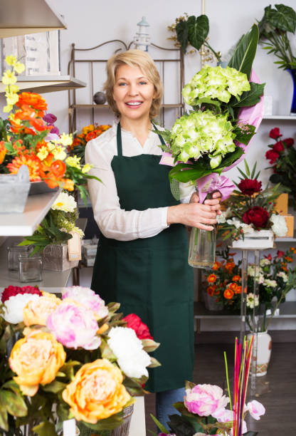 istock Florist with fresh flowers 826109536