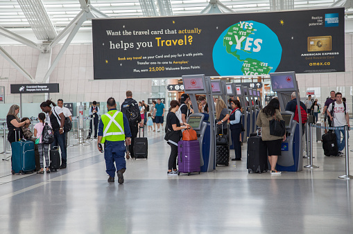 People Walking through Terminal 1 at Pearson International Airport in Toronto, Ontario, Canada