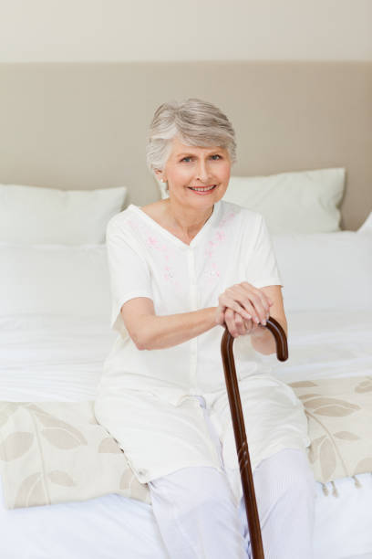 istock Retired woman with her walking stick 826130184
