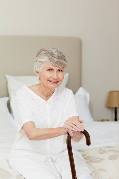 istock Retired woman with her walking stick 826130198