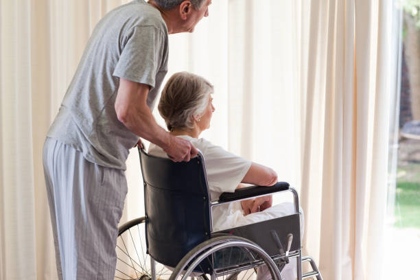 istock Retired couple looking out the window 826130254
