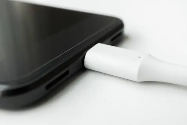 White USB Type-C connected to black smartphone port