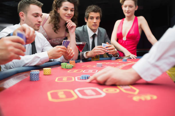 istock People playing exciting game of poker 826140360