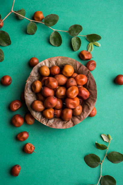 Organic Indian Jujube or ber or berry (Ziziphus mauritiana) moody lighting, selective focus