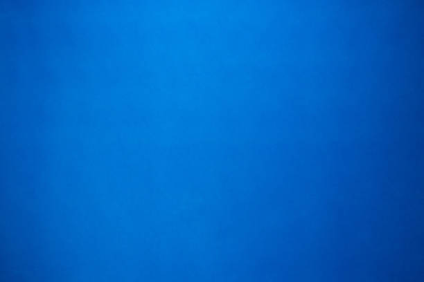 istock Gradient blue color paper sheet texture background. Blank wallpaper in cool tone concept for use in website or wrapping. 826144414