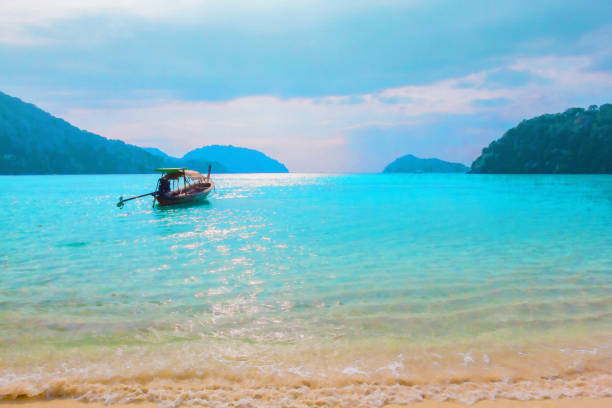 istock Long tail boat on the blue sea for summer or holiday background. 826146986