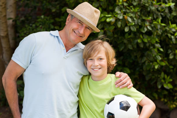 istock Grandfather and his grandson looking at the camera 826147372