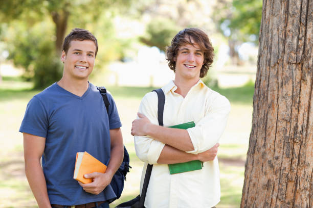 istock Close up of two standing male students 826154644