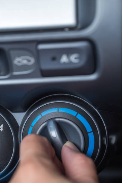 istock hand turn knob to car cooling temp adjust, dashboard air conditioner 826155722