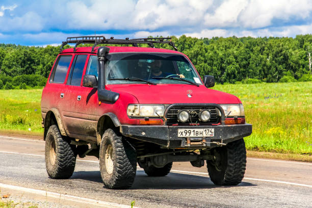 CHELYABINSK REGION, RUSSIA - JULY 10, 2017: Off-road car Toyota Land Cruiser 80 at the countryside.