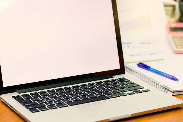 istock Computer laptop on business dest with blank screen for copy space. (Vintage tone) 826159592