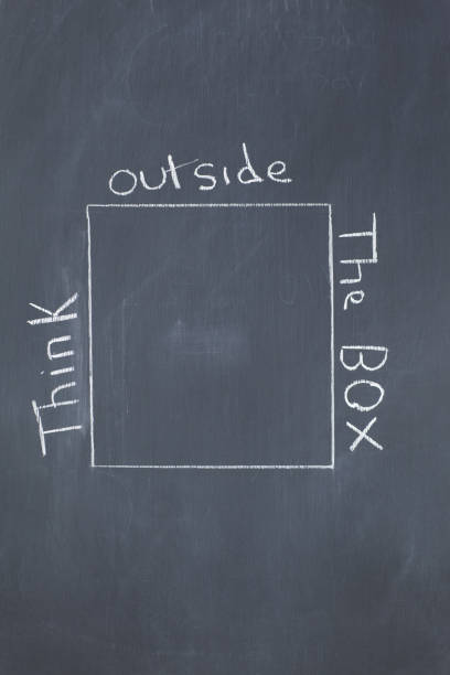 istock Close up of a blackboard with a cube drawn on it 826162514