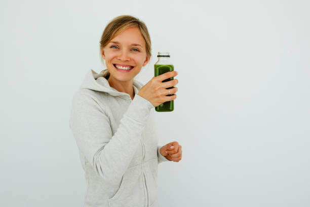 istock Satisfied healthy woman drinking smoothie 826162932