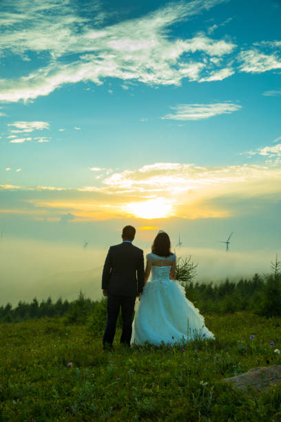 Wedding couple standing on mountain