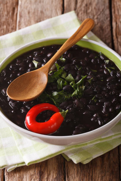 istock Vegetarian black bean soup close up in a bowl. Vertical 826175890